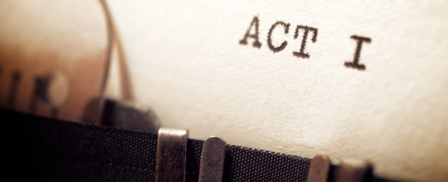 Close up image of a typewriter, with the phrase ‘Act 1’ on the page.